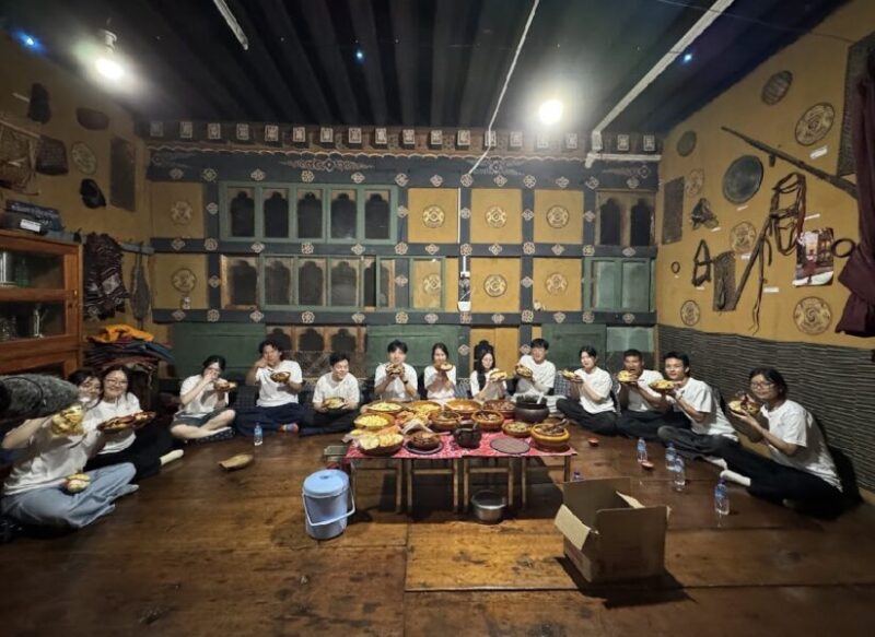 Youths share a traditional meal during the Going Bhutan series.