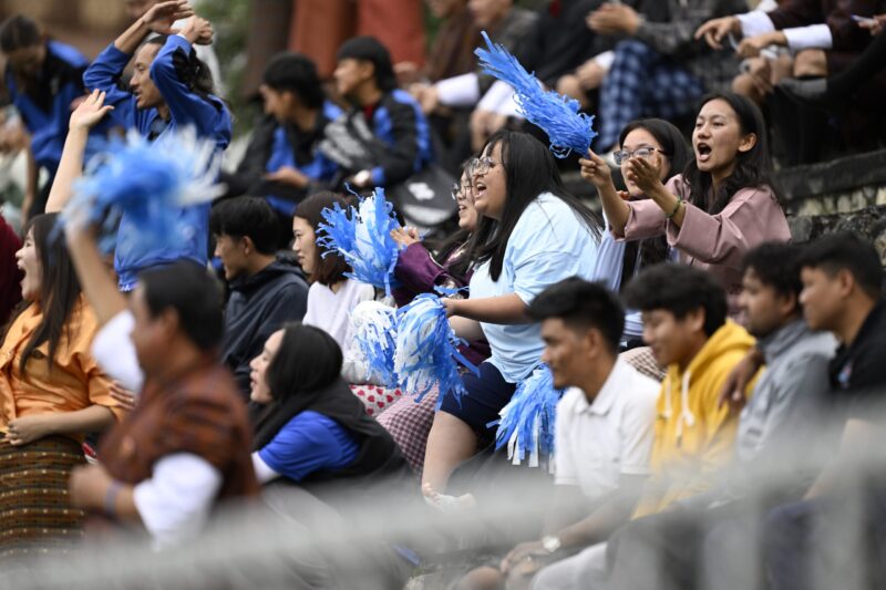 Fans cheering for Royal Thimphu College FC at the football ground