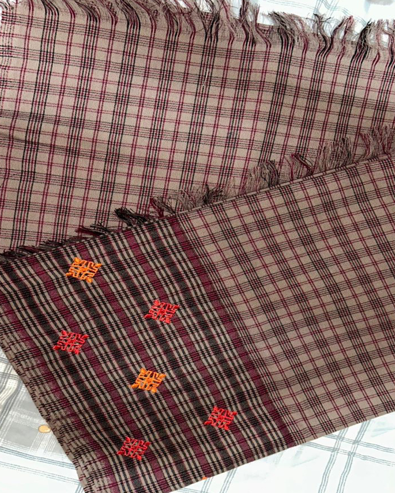 Bhutanese Kira with checkered and floral patterns.