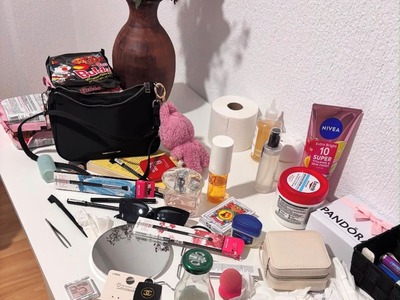 A person selecting a photo of a beauty product or cosmetic item in an online media gallery